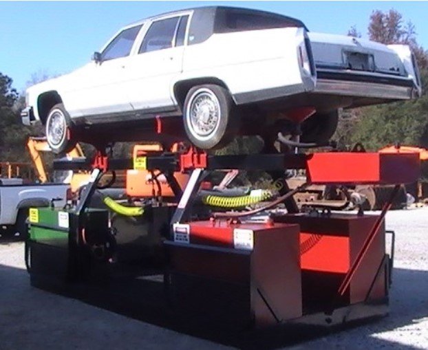White car lifted by a vehicle rack